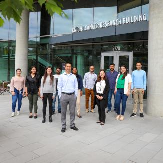 Dr. Bertassoni and Team standing in front of the Knight Cancer Research Building