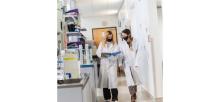 researchers walking in the lab